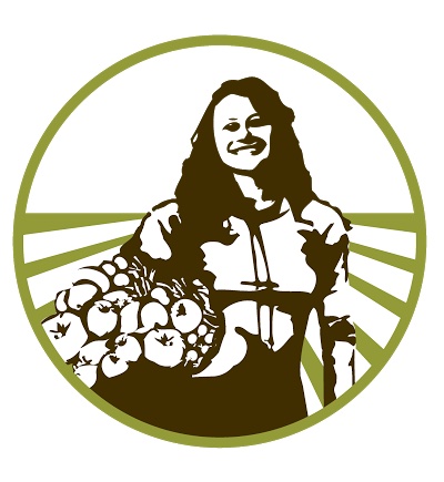 scape harvest in green crates in front of field